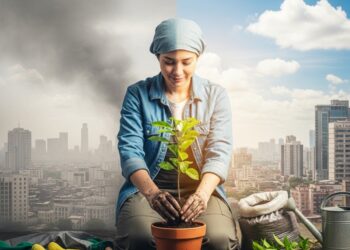 A person position int the middle of the image plants a small tree in a pot, with a hazy, polluted city skyline in the background slowly transforming into